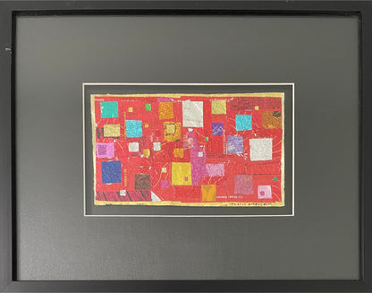 Framed artwork with colorful square pattern on a red background