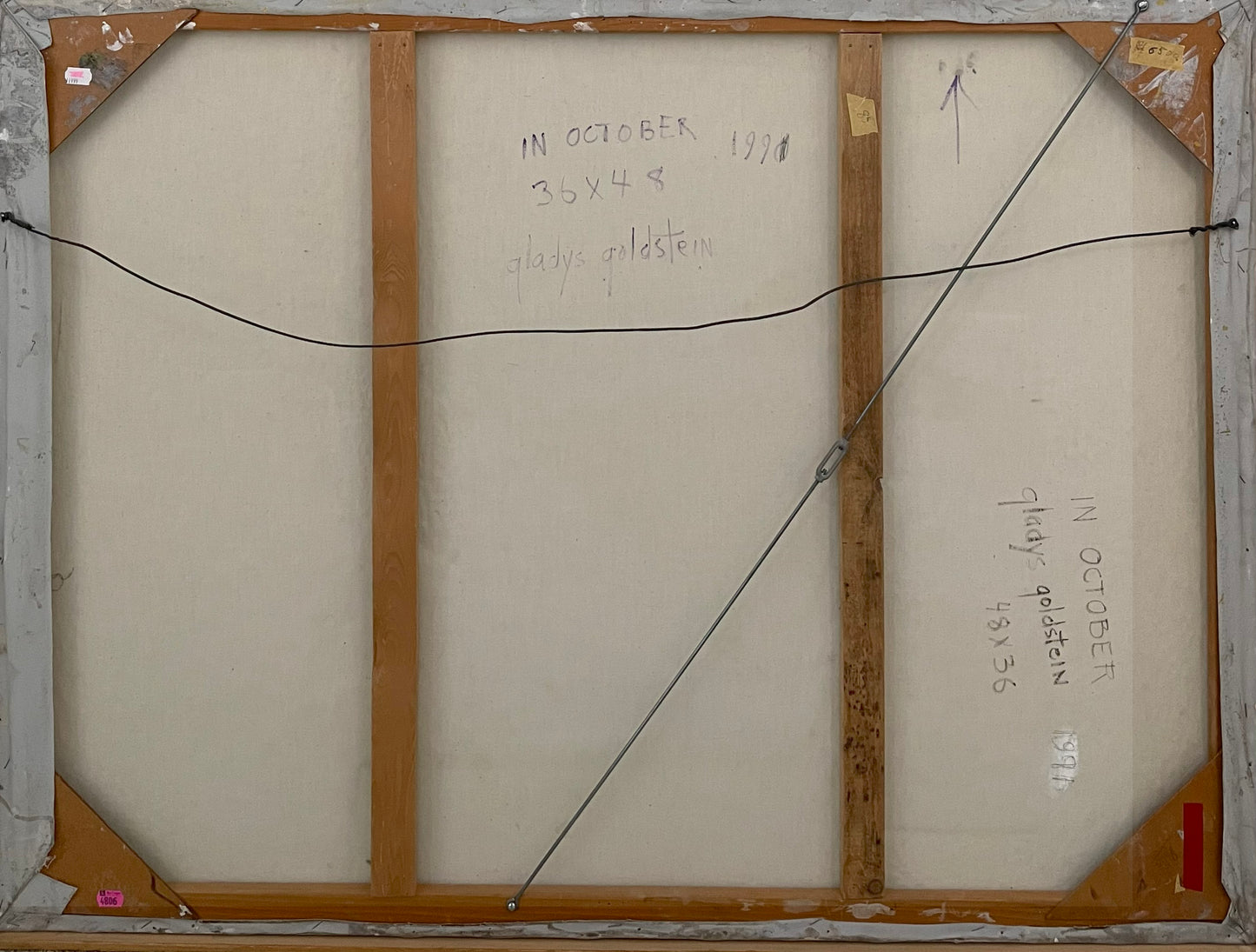 Back of a painting with text and measurements