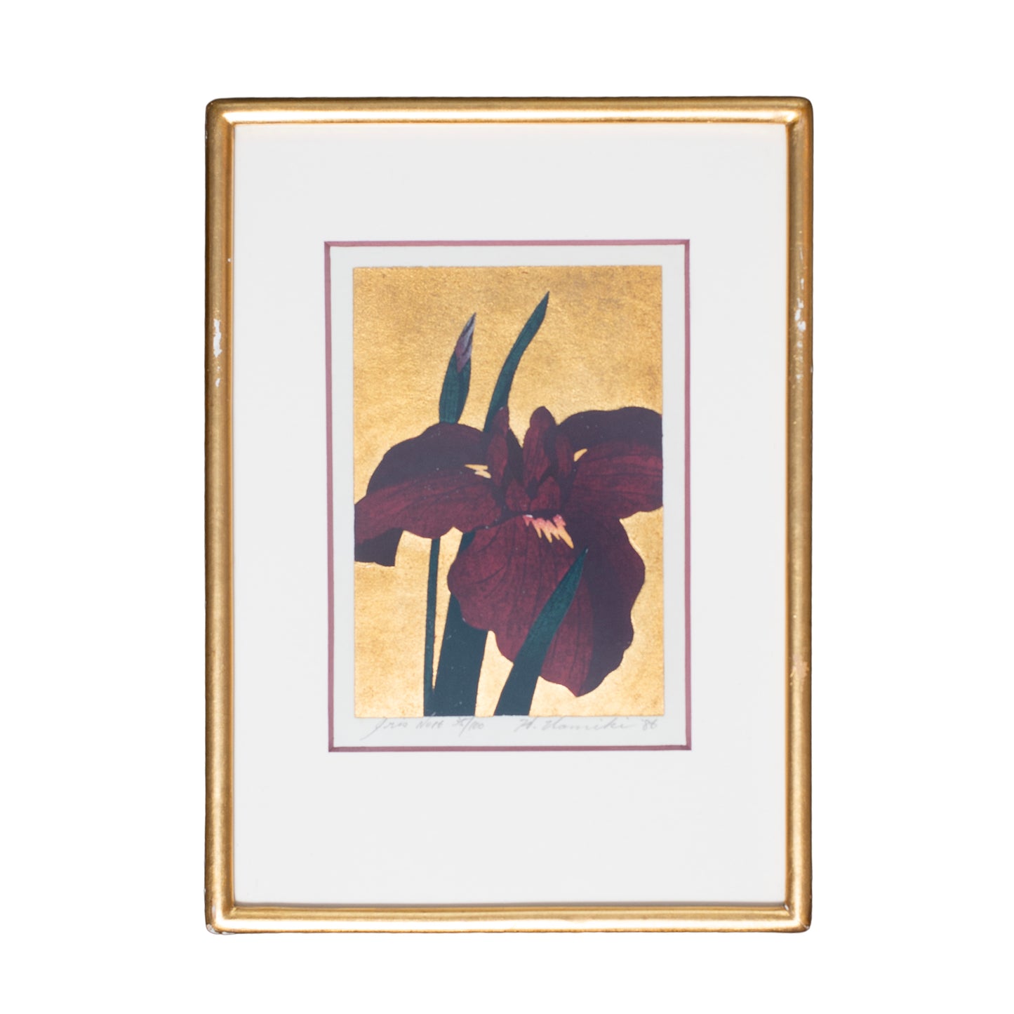 Framed artwork of a purple flower on a gold background