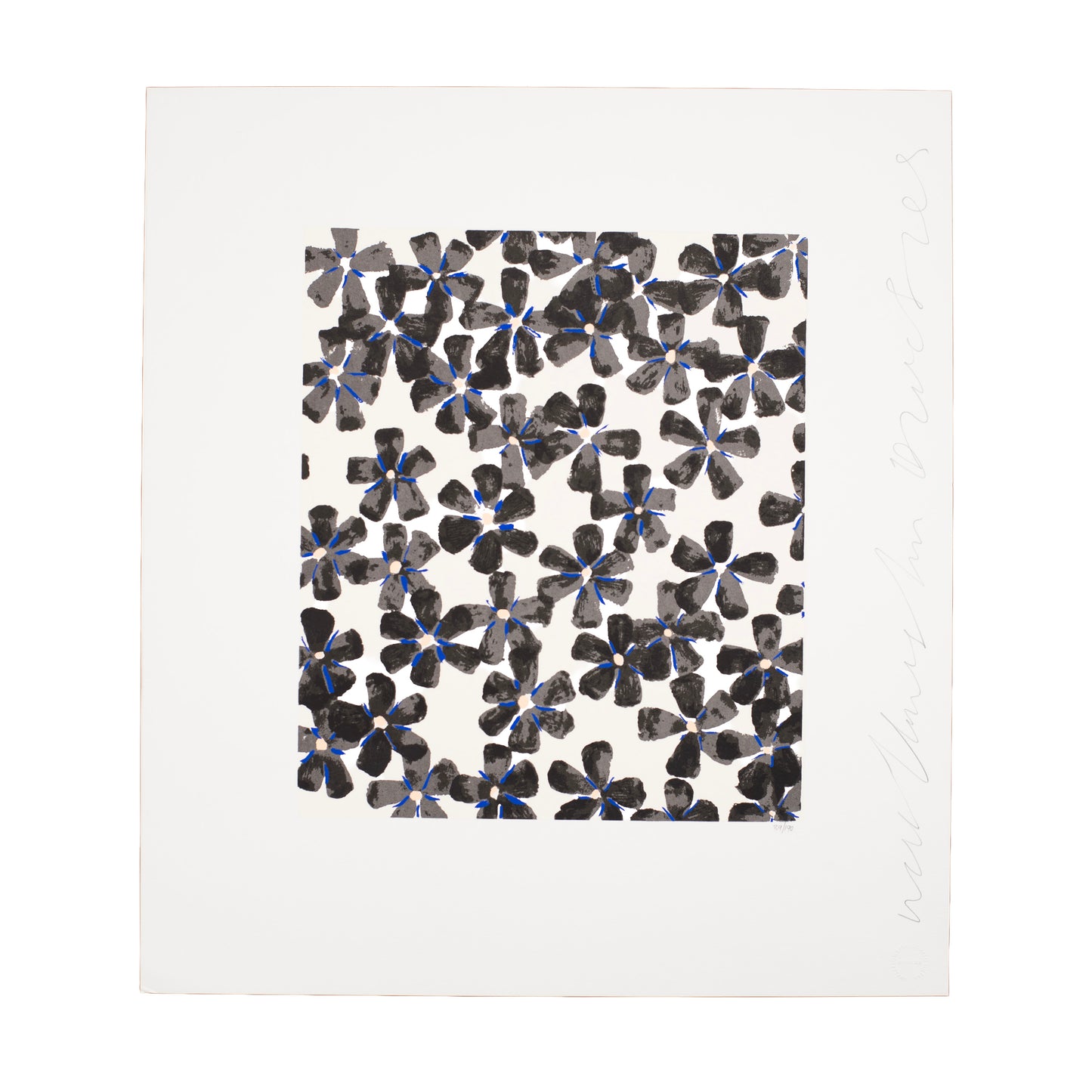 Patterned paper with black and blue floral design on a white background