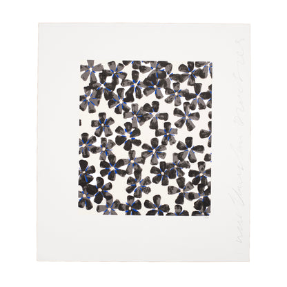 Patterned paper with black and blue floral design on a white background