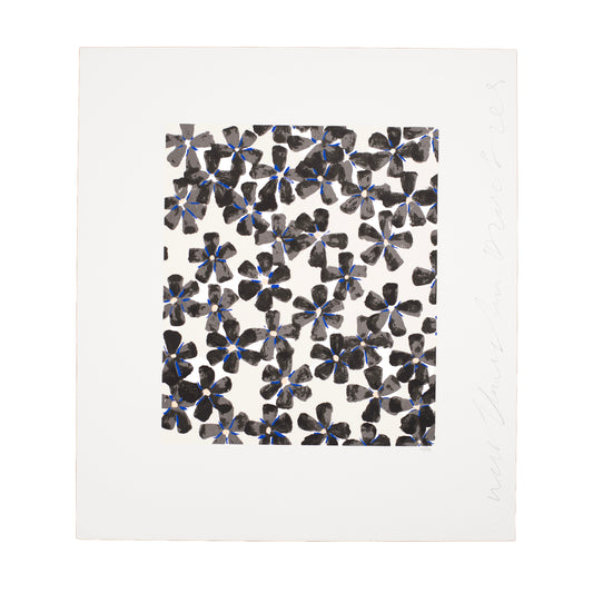 Patterned paper with black and blue floral design on a white background