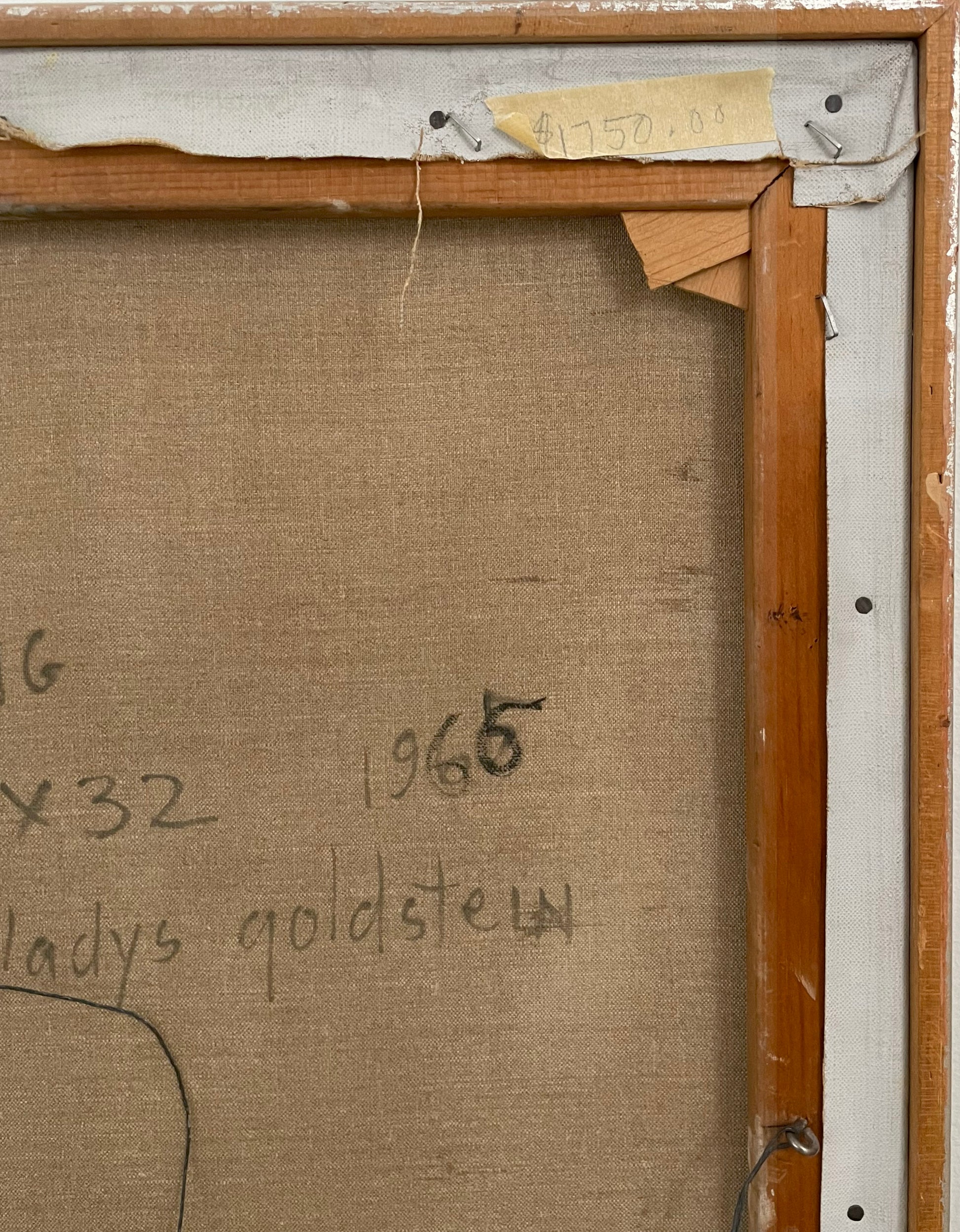 Back of a painting with measurements and text, framed in wood.