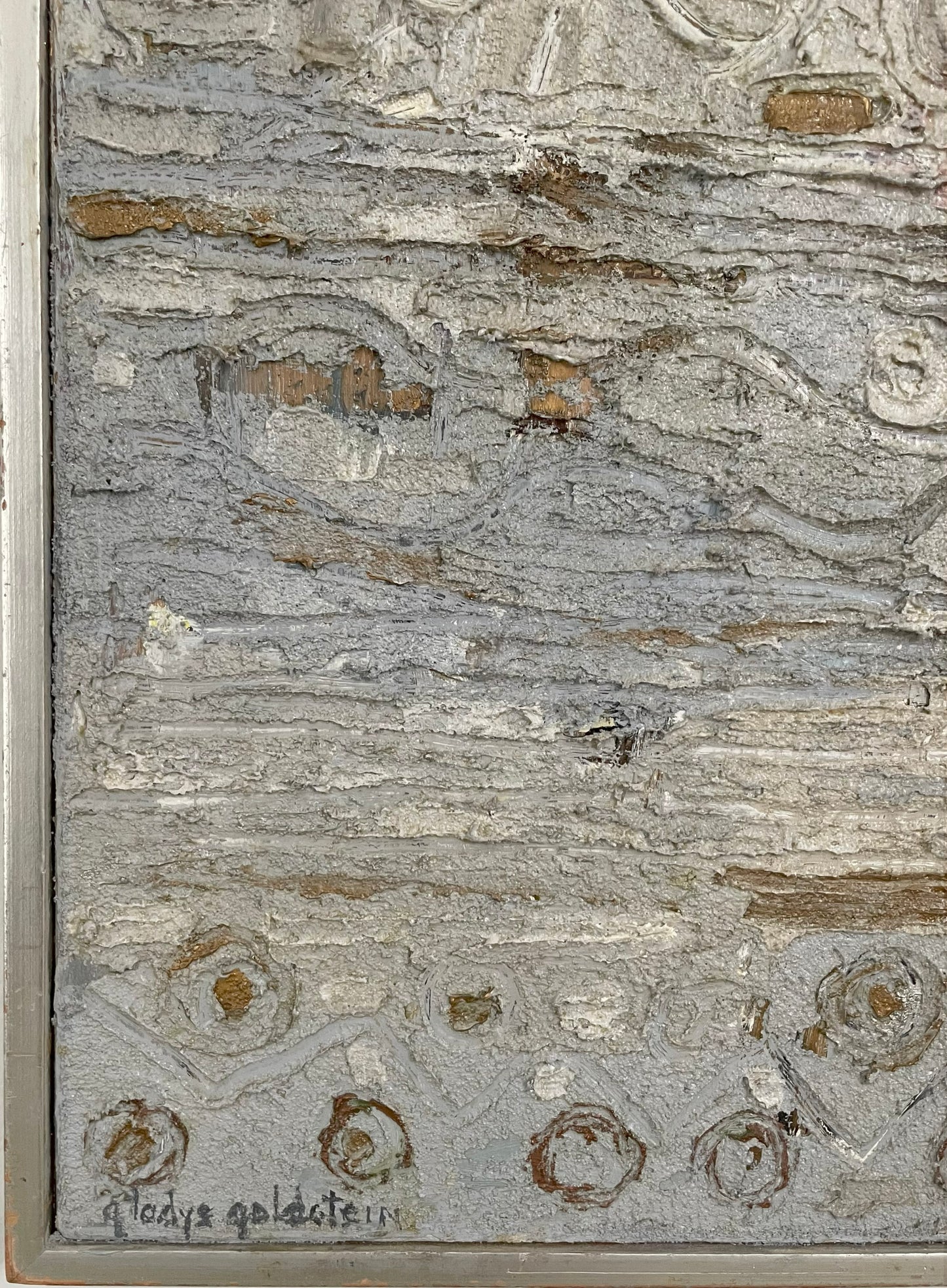Textured surface with patterns and a signature at the bottom right corner